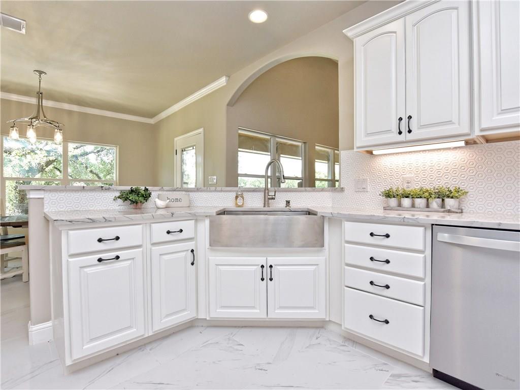 133 Tuscany Way Georgetown, TX 78633 - Photo 14 of 30 a kitchen with cabinets appliances and a window