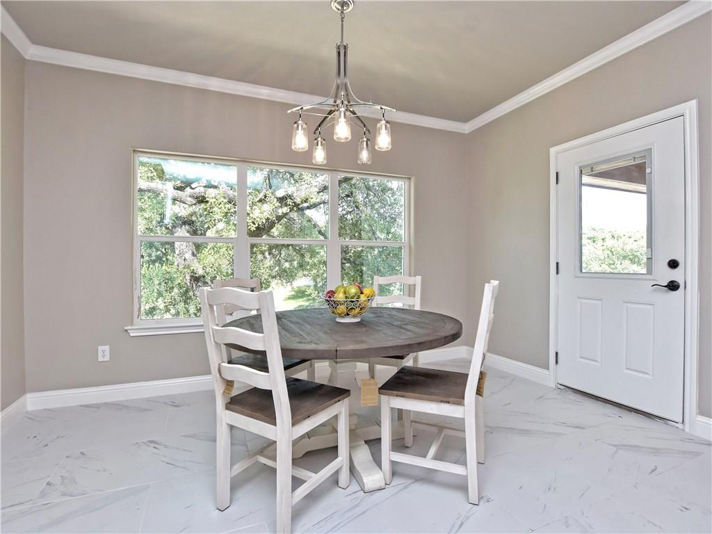 133 Tuscany Way Georgetown, TX 78633 - Photo 15 of 30 a dining room with furniture window and outside view