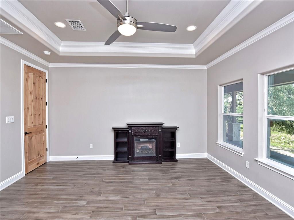 133 Tuscany Way Georgetown, TX 78633 - Photo 17 of 30 wooden floor in an empty room with a window