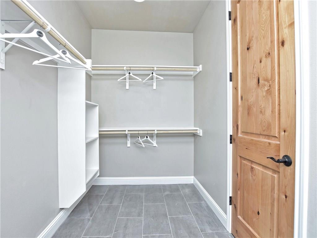 133 Tuscany Way Georgetown, TX 78633 - Photo 18 of 30 a view of walk in closet with empty racks