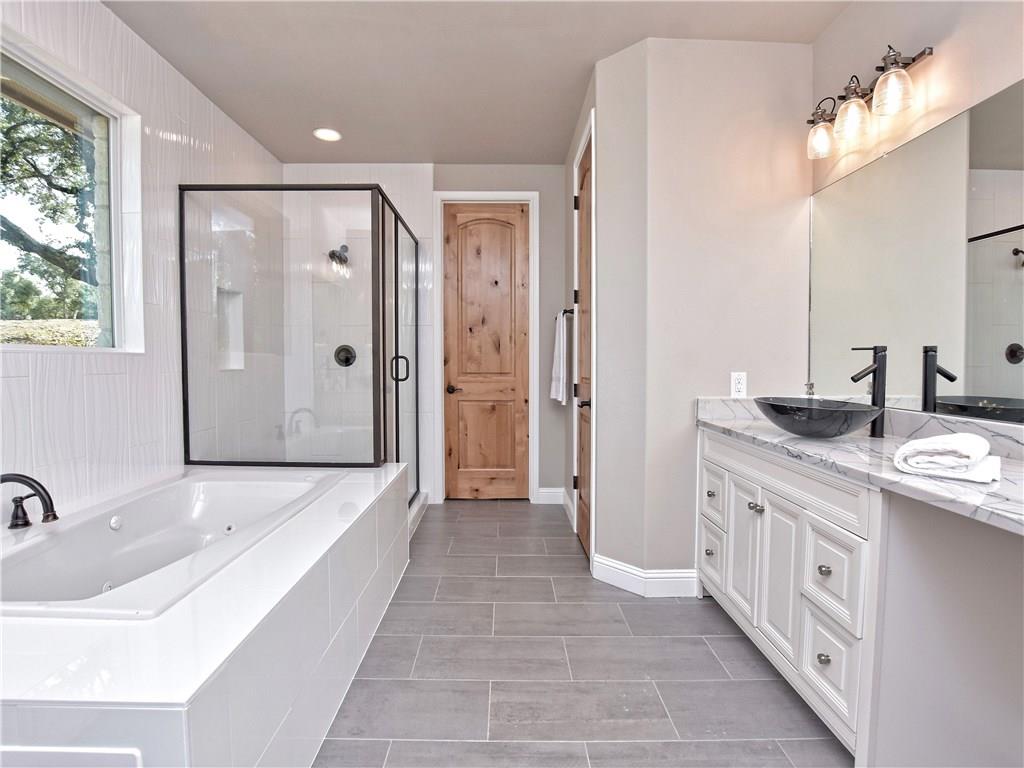 133 Tuscany Way Georgetown, TX 78633 - Photo 20 of 30 a bathroom with a double vanity sink and a mirror