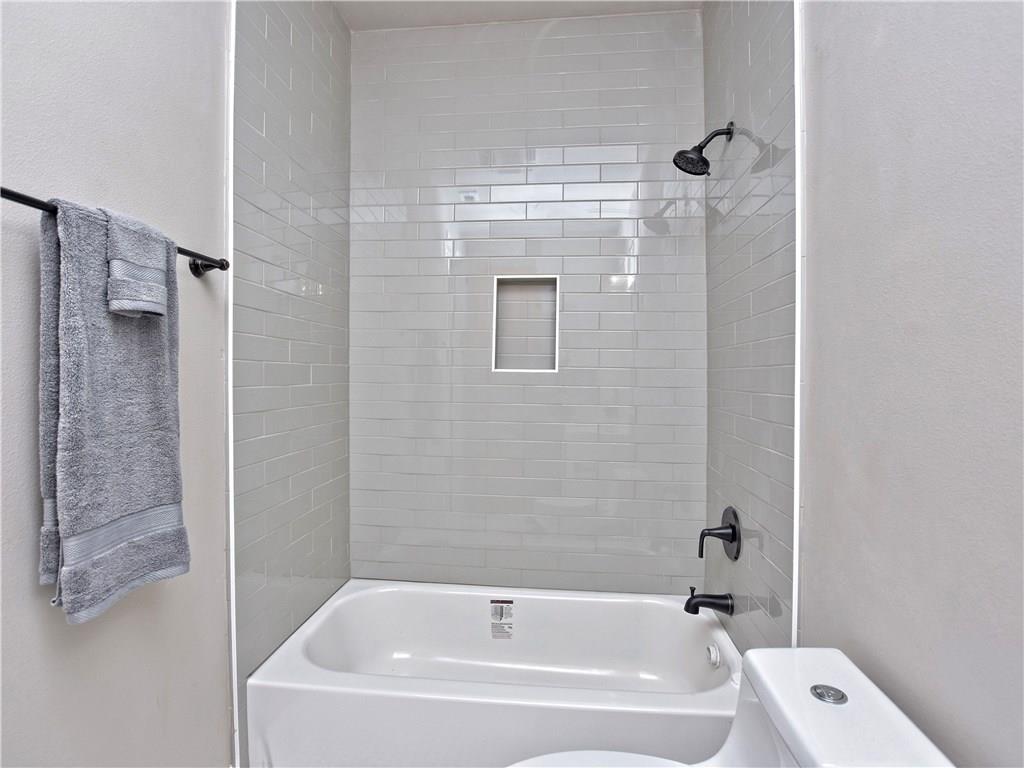 133 Tuscany Way Georgetown, TX 78633 - Photo 27 of 30 a bathroom with a bathtub and a shower