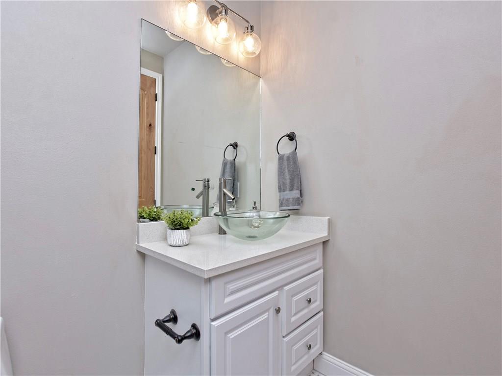 133 Tuscany Way Georgetown, TX 78633 - Photo 28 of 30 a bathroom with a sink and a mirror