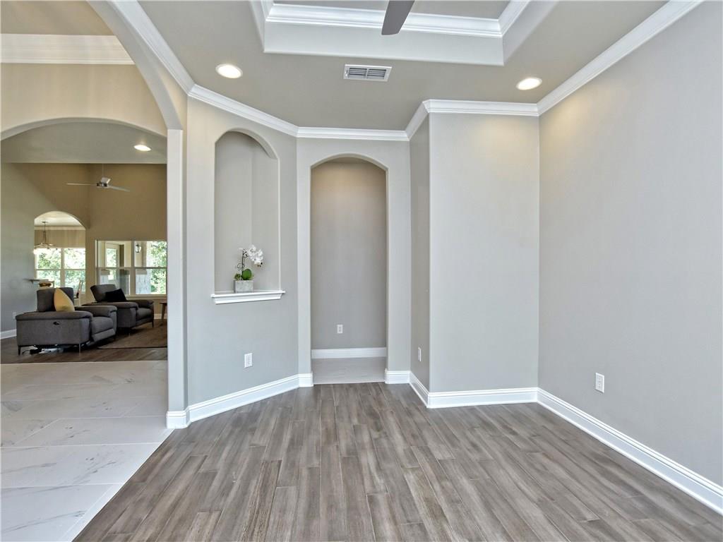 133 Tuscany Way Georgetown, TX 78633 - Photo 10 of 30 a view of a livingroom with wooden floor