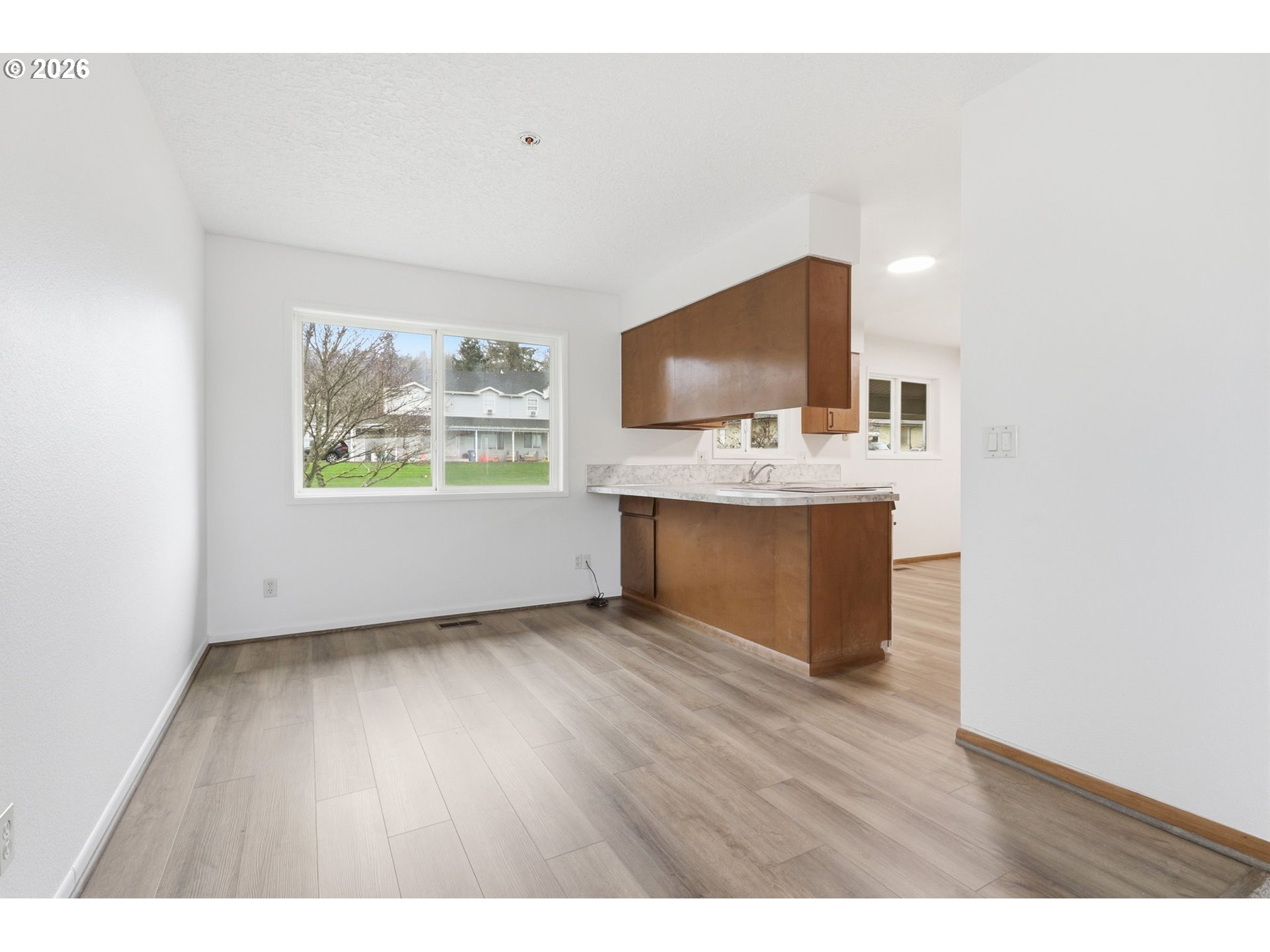 52890 Northwest 7th Street Scappoose, OR 97056 - Photo 11 of 48 a living room with a flat screen tv a rug and a window