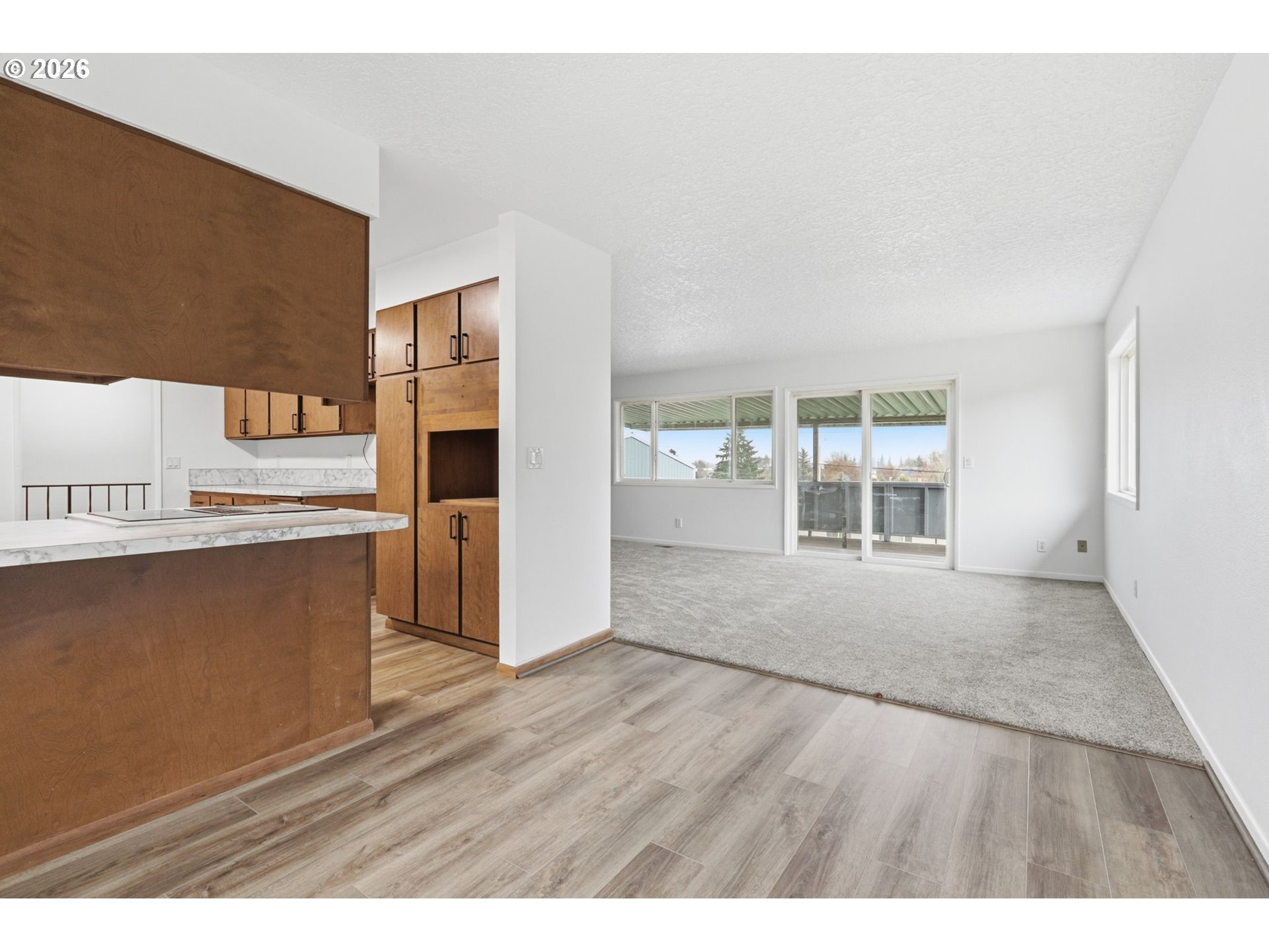 52890 Northwest 7th Street Scappoose, OR 97056 - Photo 12 of 48 a view of a kitchen with wooden floor