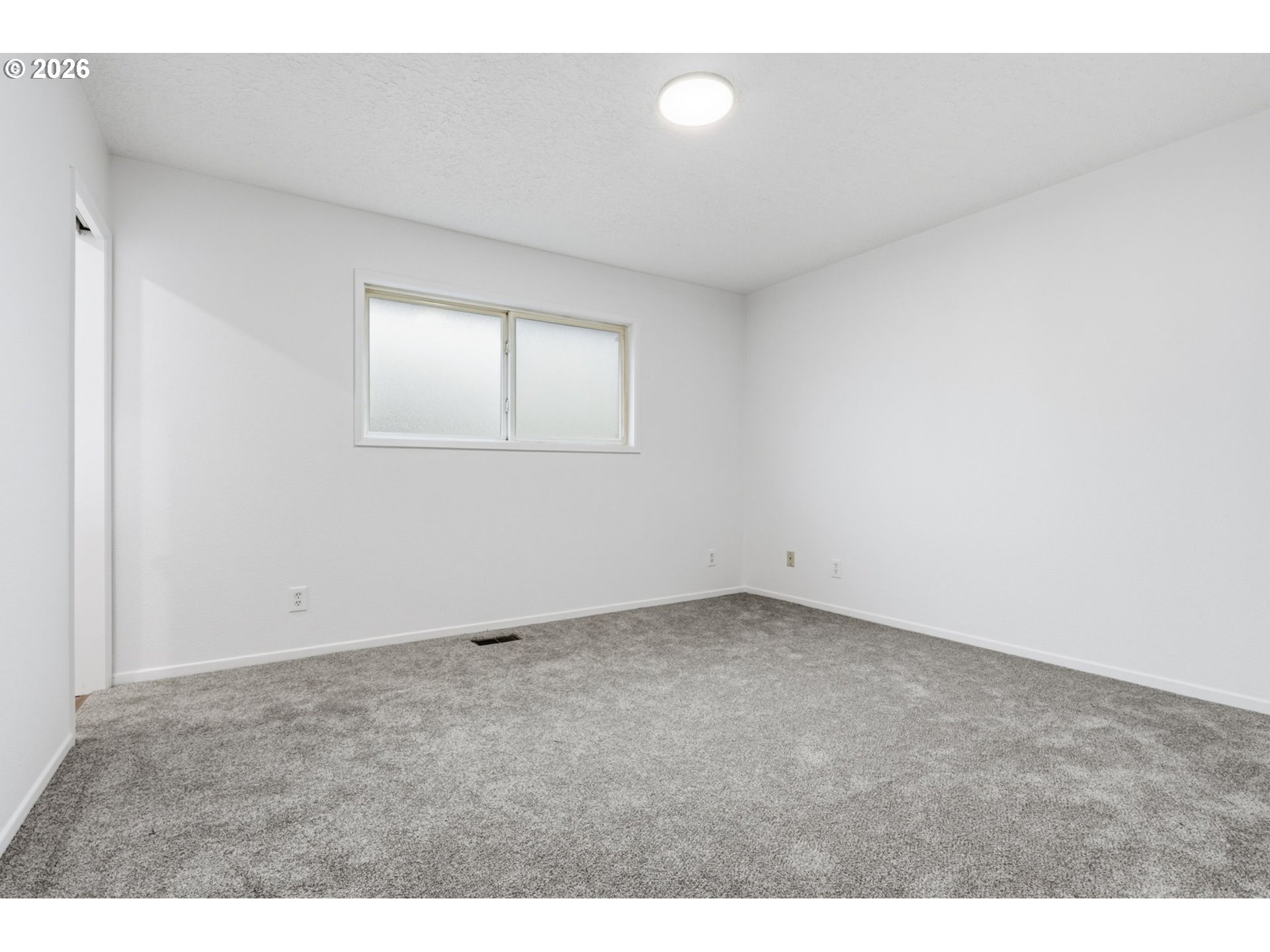 52890 Northwest 7th Street Scappoose, OR 97056 - Photo 16 of 48 a view of an empty room with a window