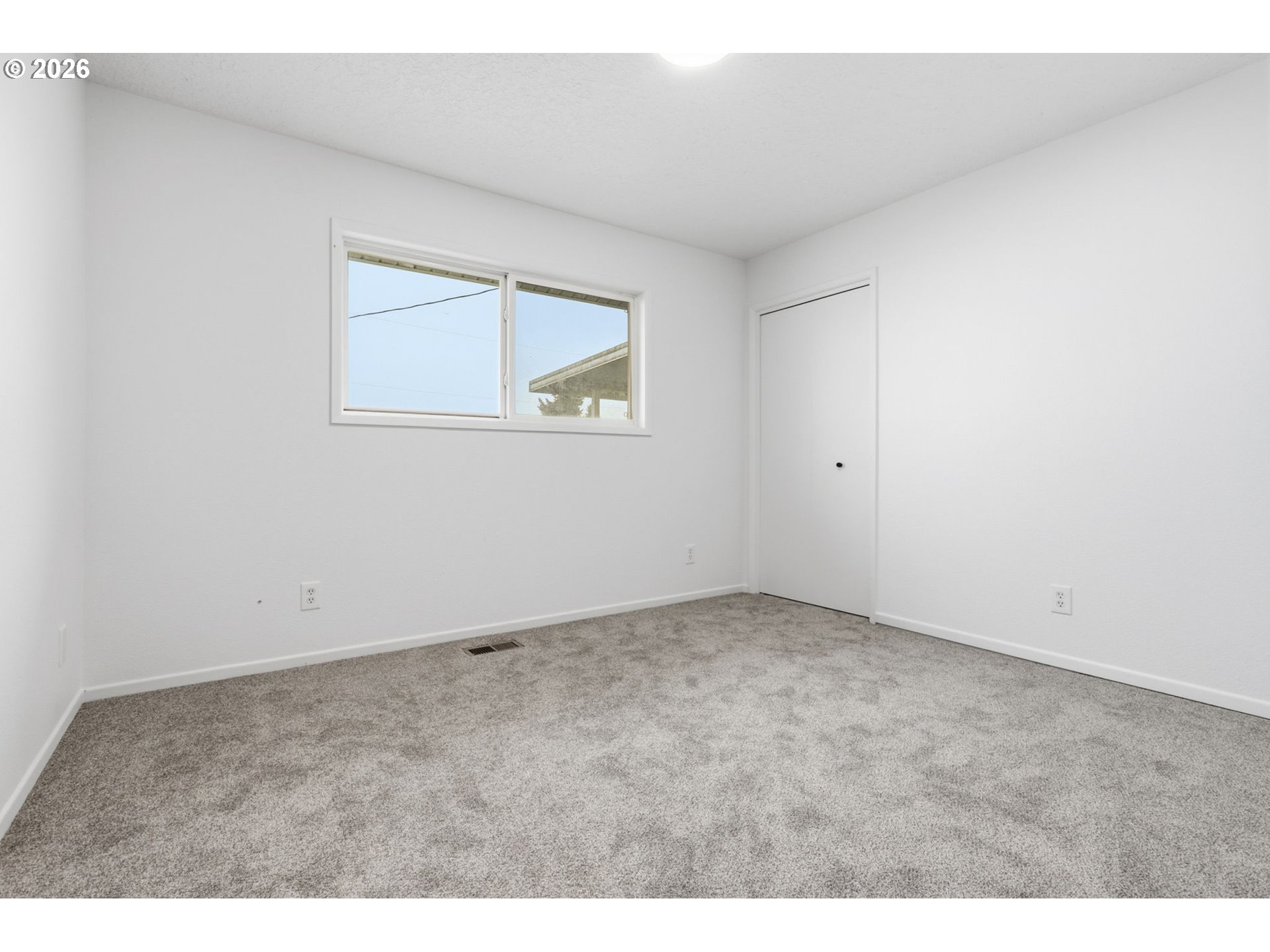 52890 Northwest 7th Street Scappoose, OR 97056 - Photo 23 of 48 a view of an empty room with a window