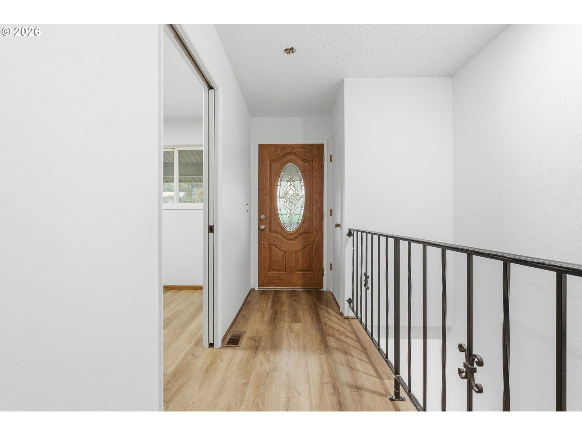 52890 Northwest 7th Street Scappoose, OR 97056 - Photo 5 of 48 a view of a hallway with wooden floor