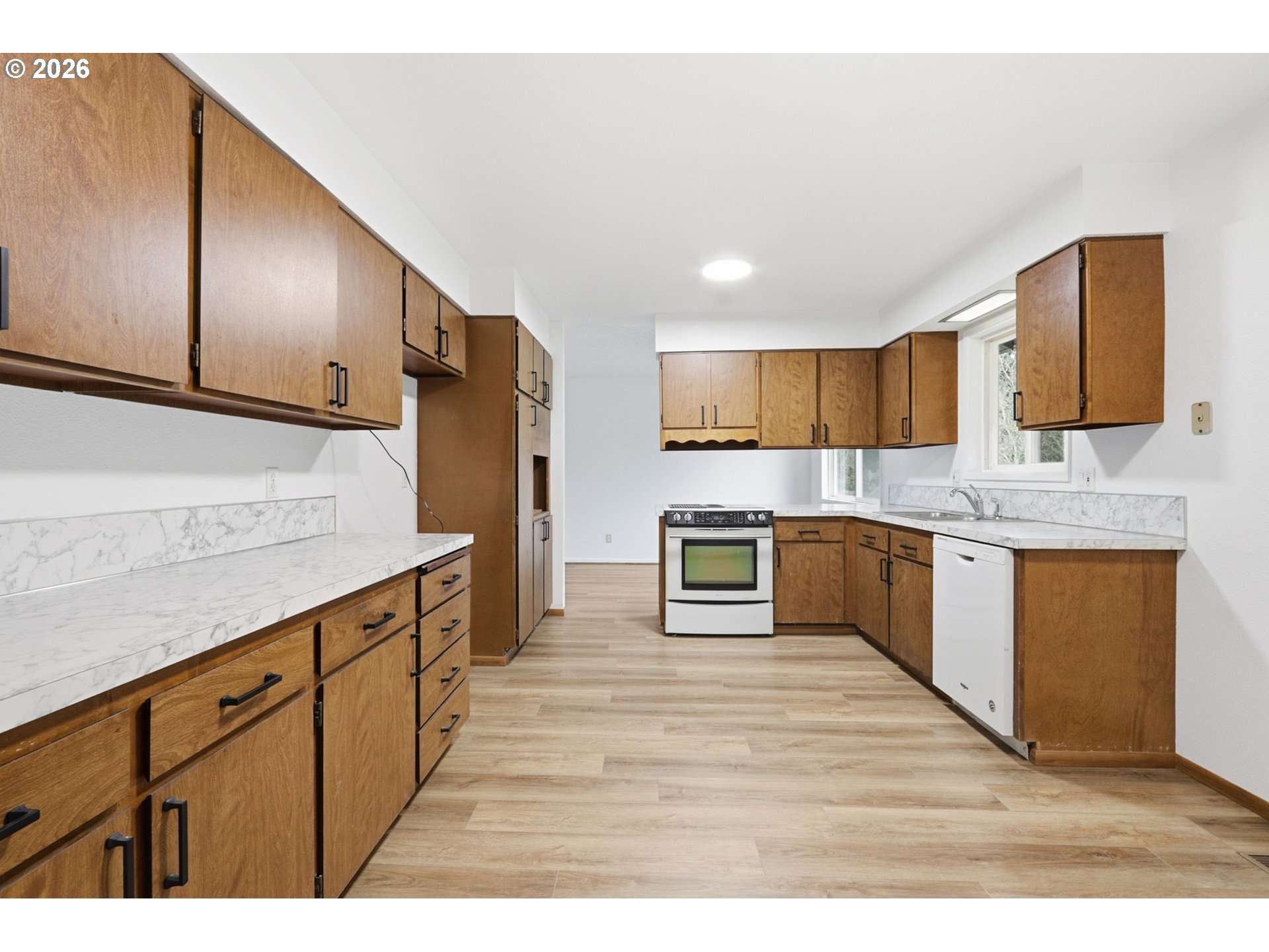 52890 Northwest 7th Street Scappoose, OR 97056 - Photo 8 of 48 a kitchen with stainless steel appliances cabinets a sink and a oven