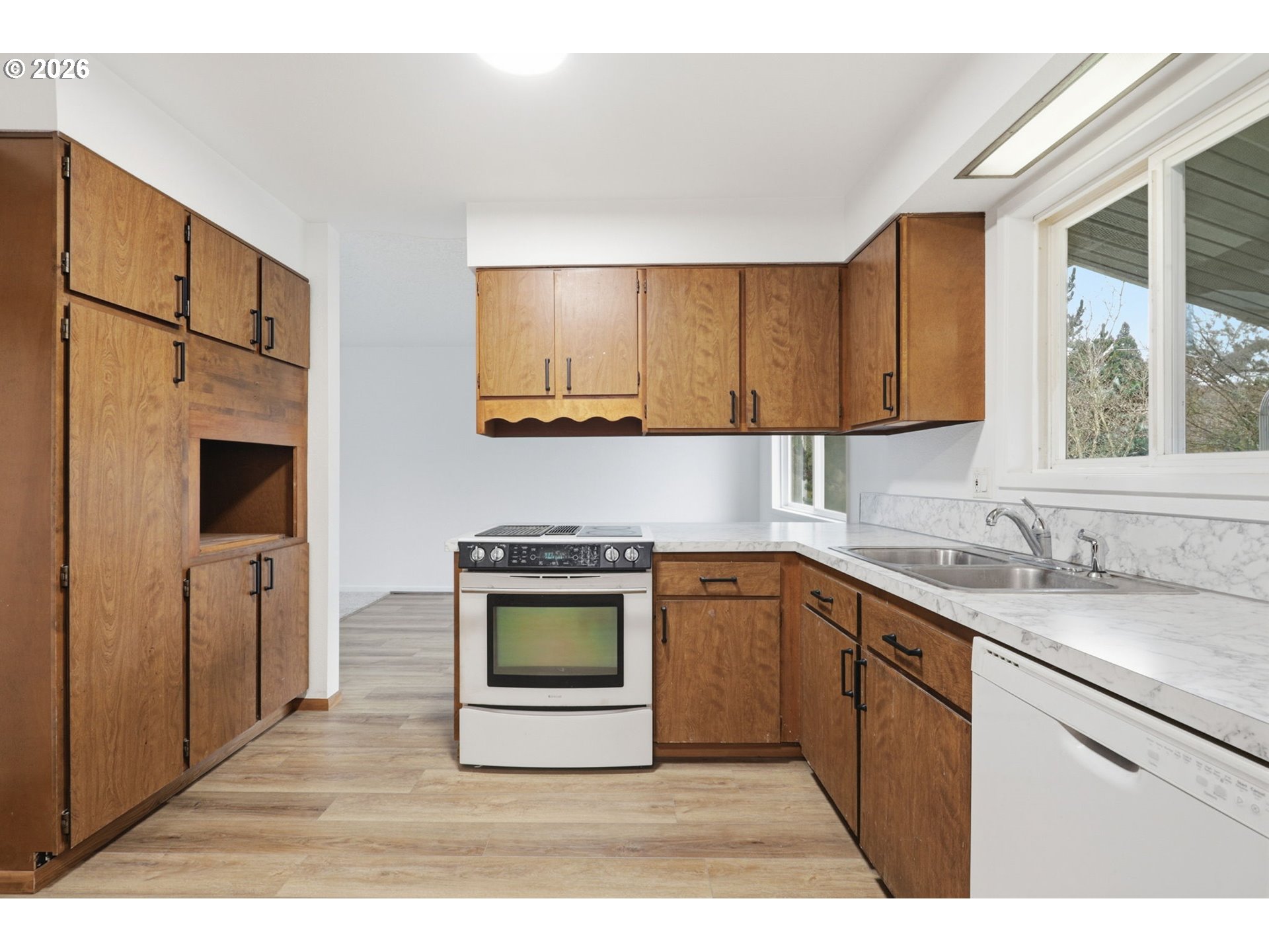 52890 Northwest 7th Street Scappoose, OR 97056 - Photo 10 of 48 a kitchen with stainless steel appliances granite countertop a stove a sink and a microwave