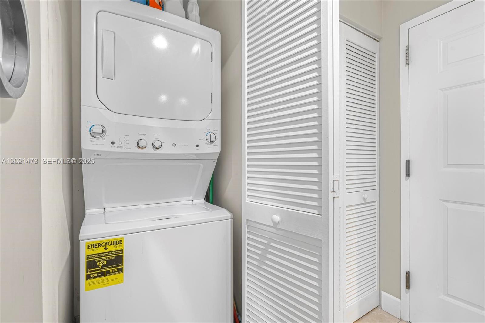 8395 Southwest 73rd Avenue, Unit 710 Miami, FL 33143 - Photo 22 of 32 a utility room with dryer and washer