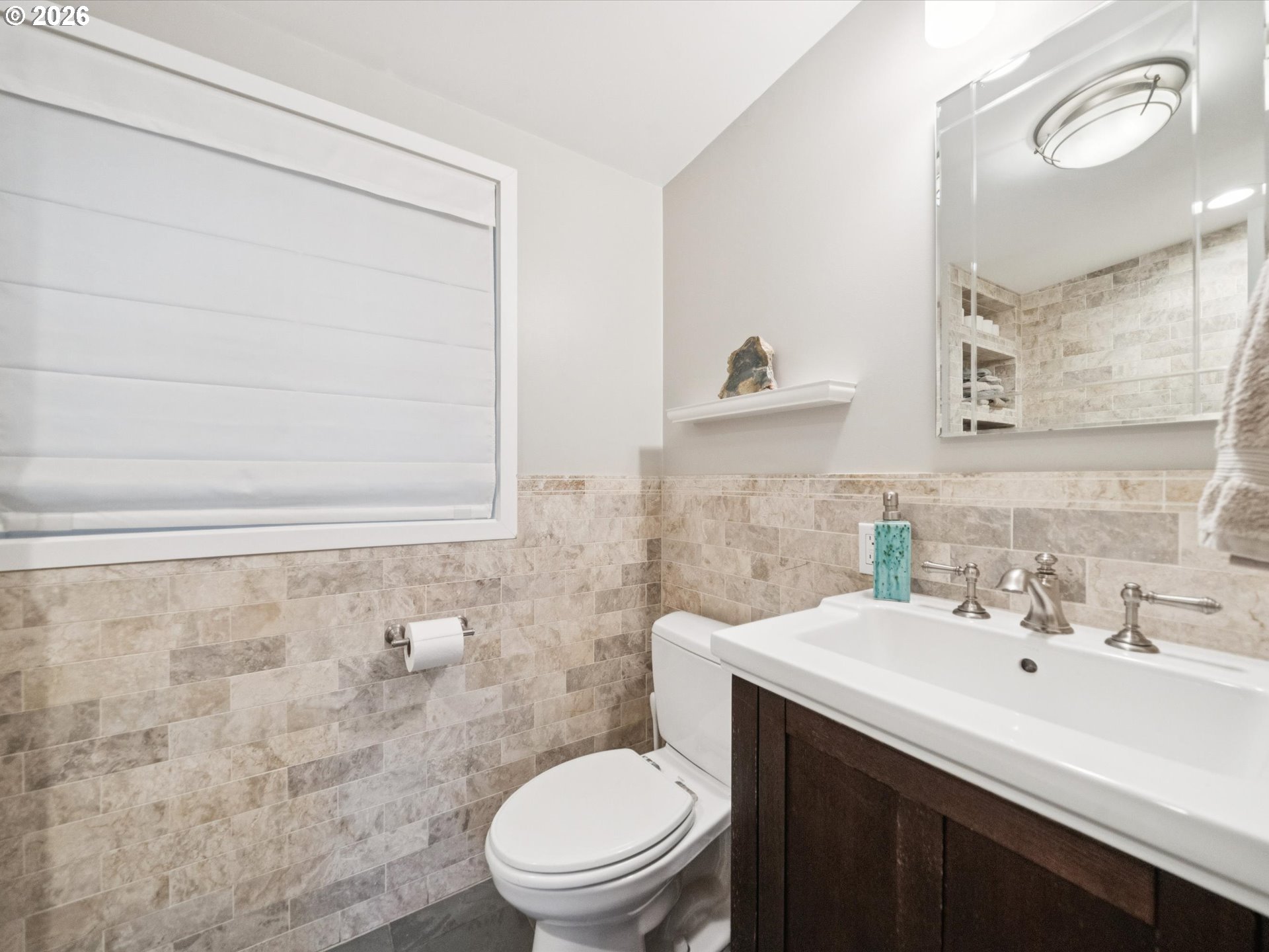 8401 Southwest Canyon Lane Portland, OR 97225 - Photo 11 of 48 a bathroom with a toilet a sink a mirror and a shower