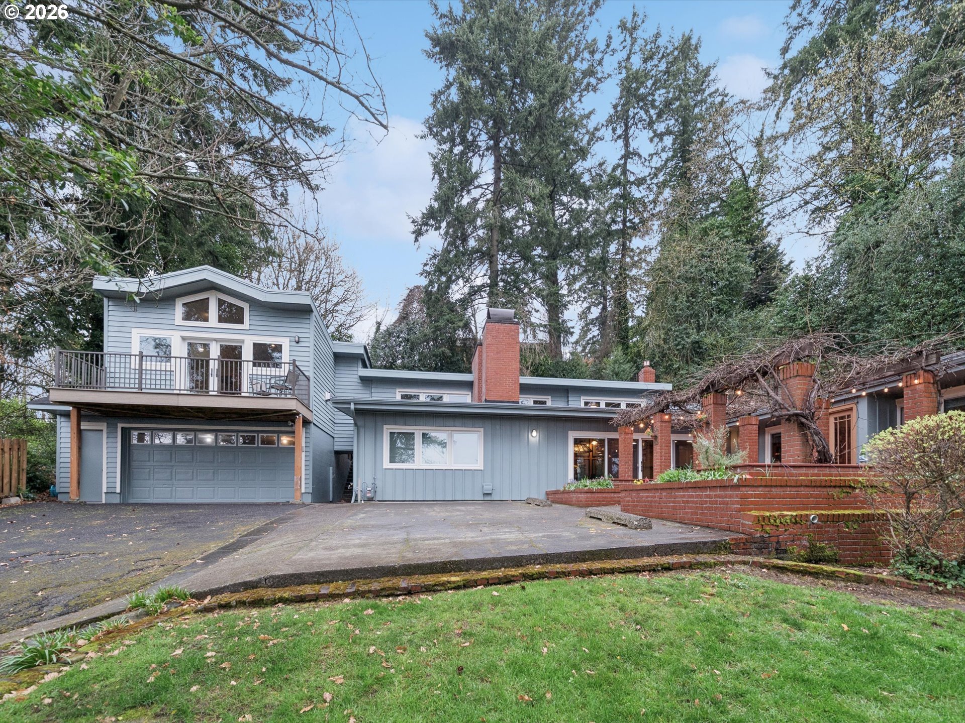 8401 Southwest Canyon Lane Portland, OR 97225 - Photo 16 of 48 front view of a house with a yard