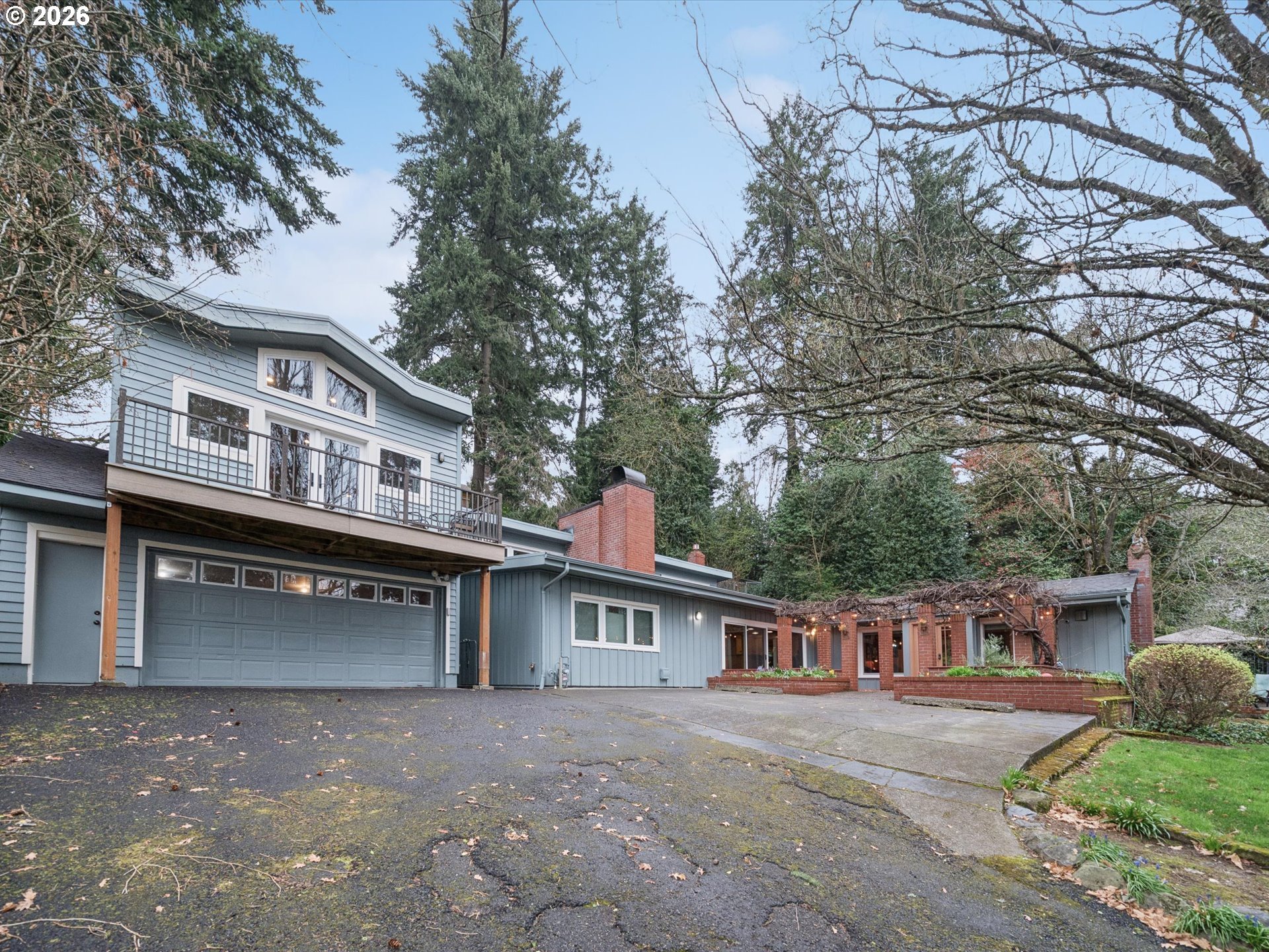 8401 Southwest Canyon Lane Portland, OR 97225 - Photo 17 of 48 a front view of a house with a yard and garage