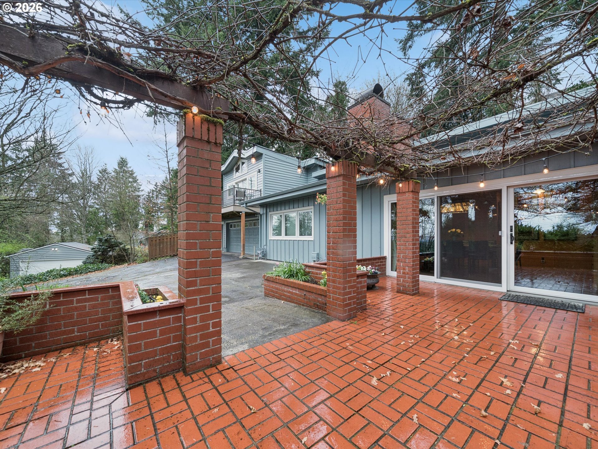 8401 Southwest Canyon Lane Portland, OR 97225 - Photo 18 of 48 a front view of a house with a patio