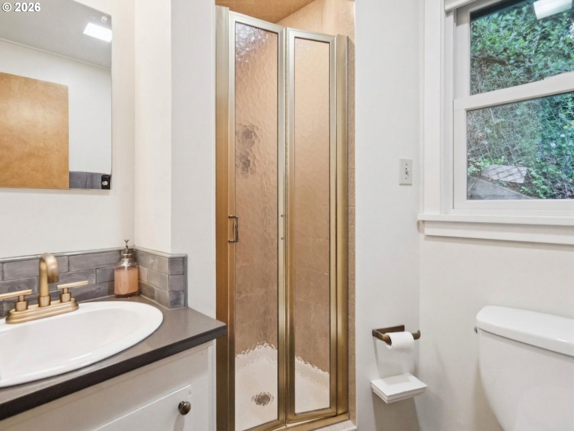 8401 Southwest Canyon Lane Portland, OR 97225 - Photo 24 of 48 a bathroom with a granite countertop sink toilet and shower