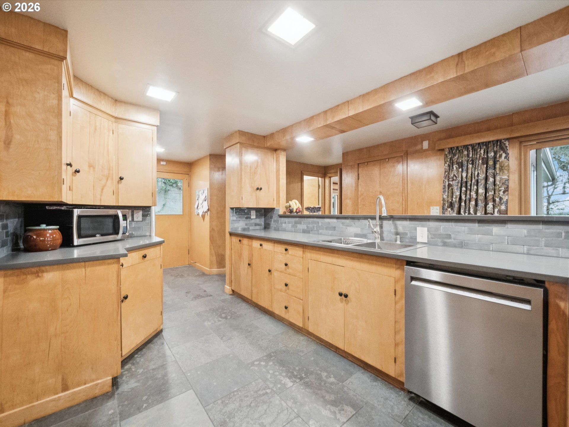 8401 Southwest Canyon Lane Portland, OR 97225 - Photo 27 of 48 a large kitchen with stainless steel appliances lots of counter space and a sink