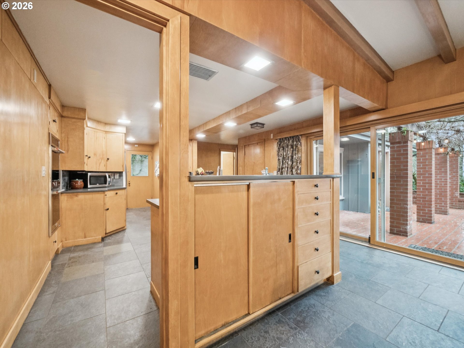 8401 Southwest Canyon Lane Portland, OR 97225 - Photo 28 of 48 a view of a kitchen with refrigerator and white cabinets