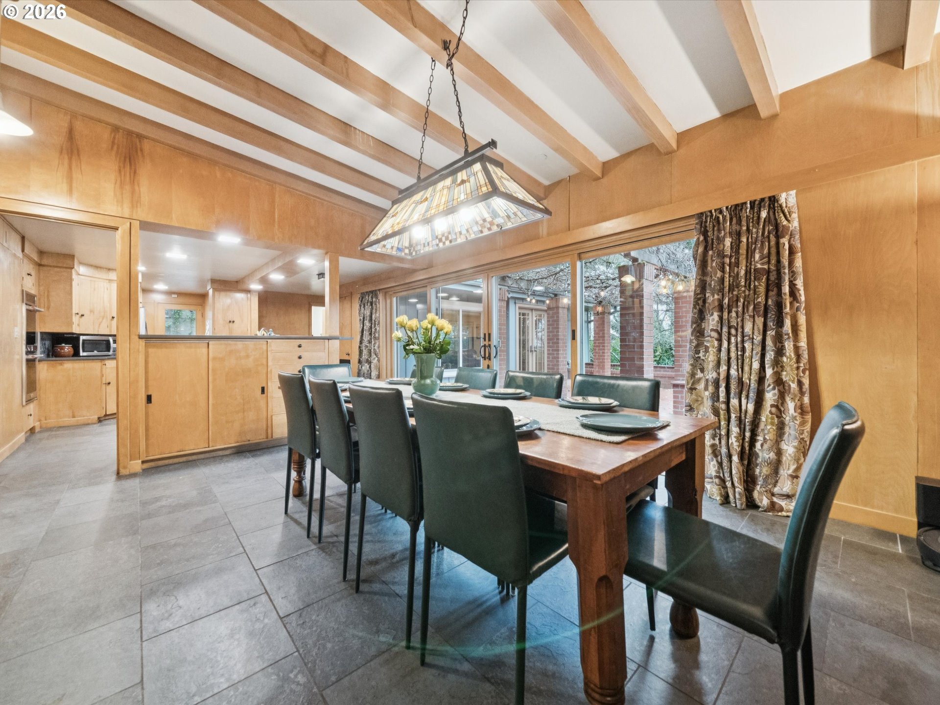 8401 Southwest Canyon Lane Portland, OR 97225 - Photo 29 of 48 a dining room with a table chairs and a kitchen view