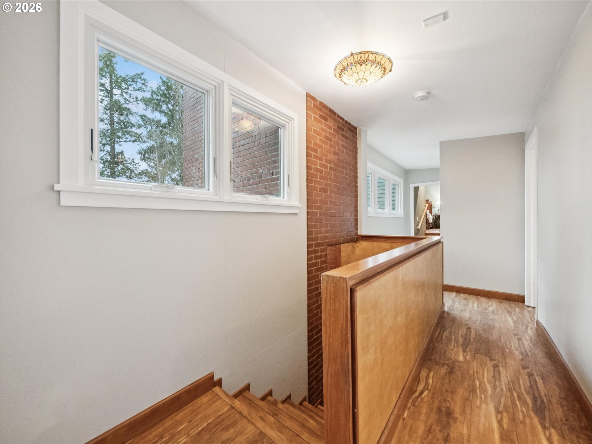 8401 Southwest Canyon Lane Portland, OR 97225 - Photo 32 of 48 a view of hallway with wooden floor and cabinet
