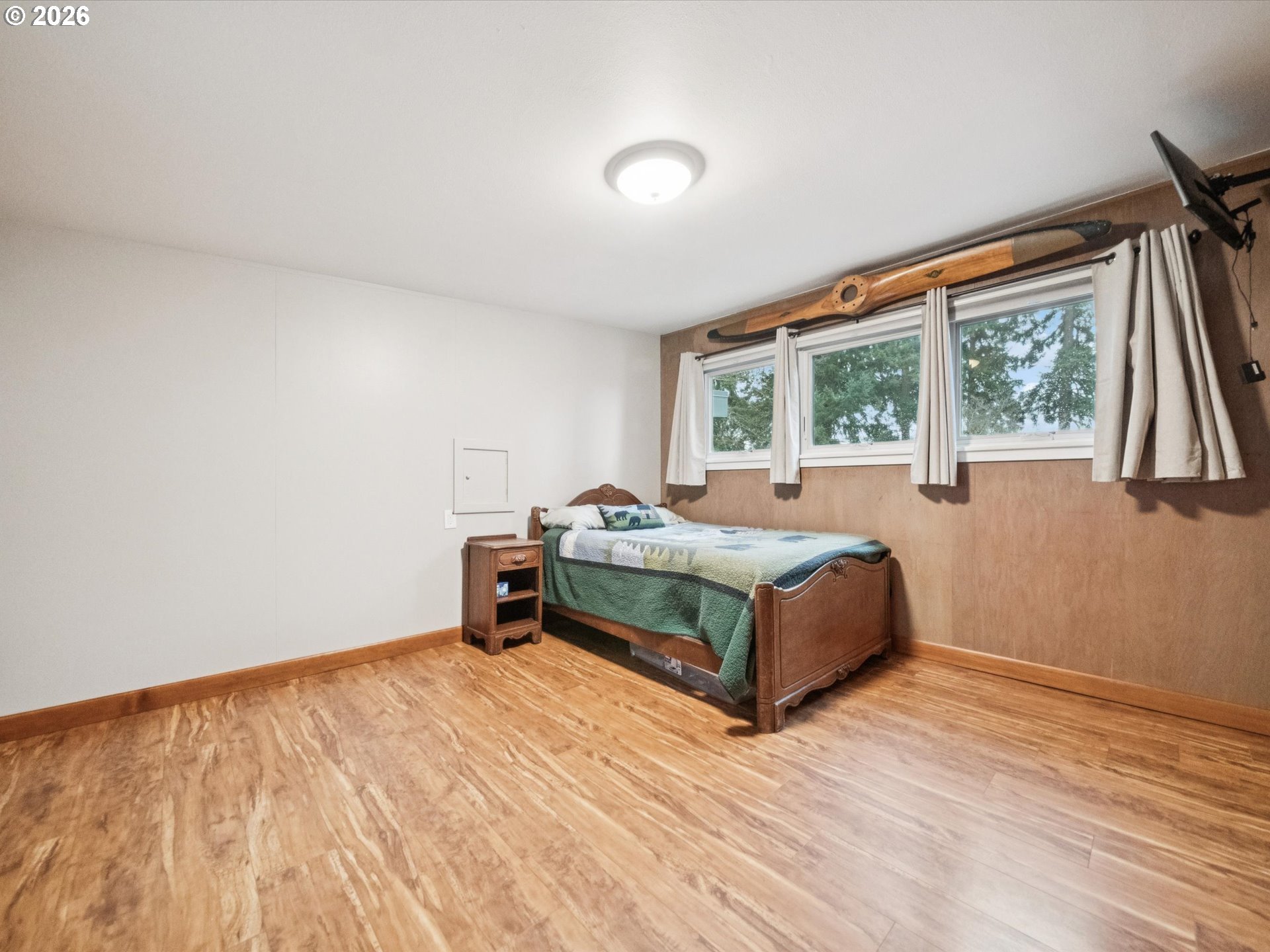 8401 Southwest Canyon Lane Portland, OR 97225 - Photo 33 of 48 a bedroom with a bed and a large window