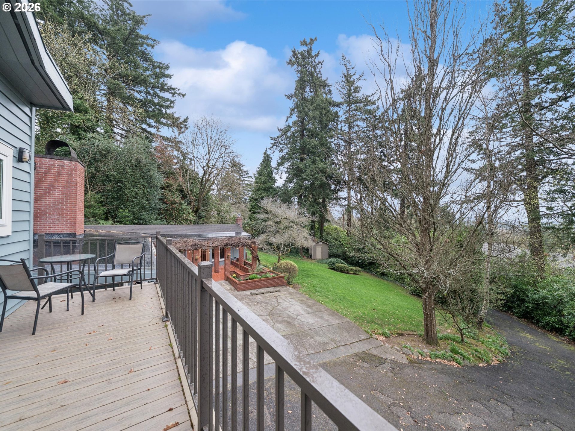 8401 Southwest Canyon Lane Portland, OR 97225 - Photo 9 of 48 a balcony with wooden floor and outdoor seating