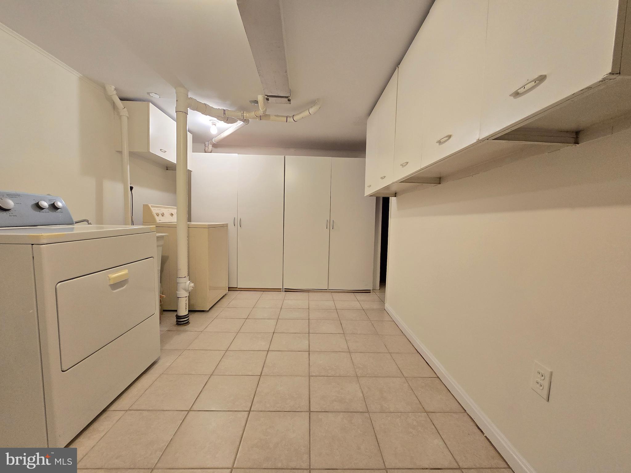 414 Kerwin Road Silver Spring, MD 20901 - Photo 11 of 14 a view of a kitchen with refrigerator and cabinet