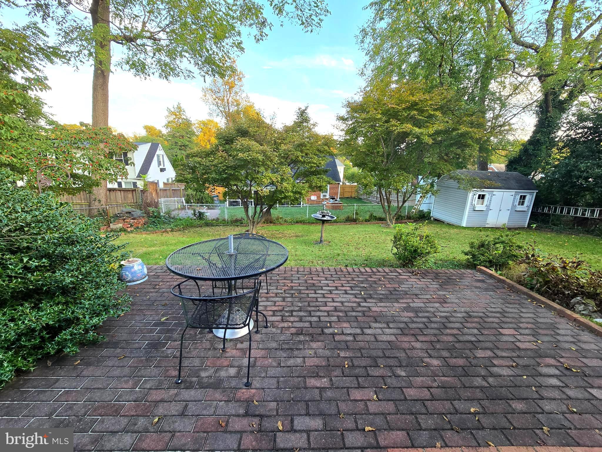 414 Kerwin Road Silver Spring, MD 20901 - Photo 14 of 14 a view of a table and chairs in backyard of the house