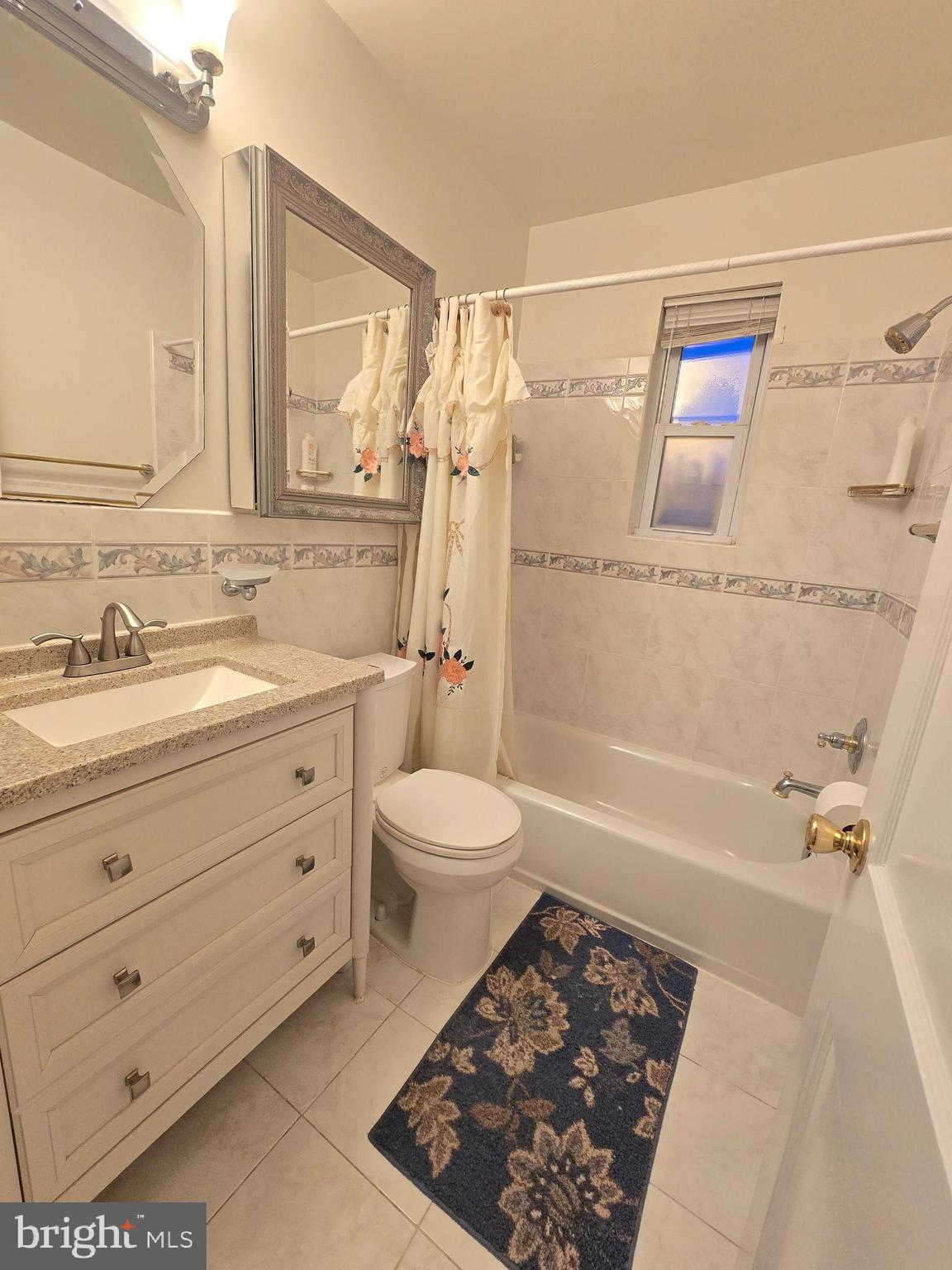 414 Kerwin Road Silver Spring, MD 20901 - Photo 7 of 14 a bathroom with a sink a toilet and shower
