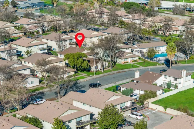 an aerial view of a houses with outdoor space