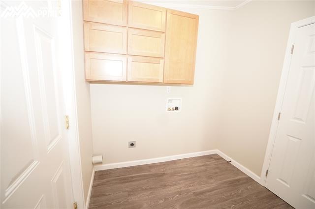 13745 Woodlake Road Elbert, CO 80106 - Photo 20 of 36 Laundry room with walk-out and half bathroom.