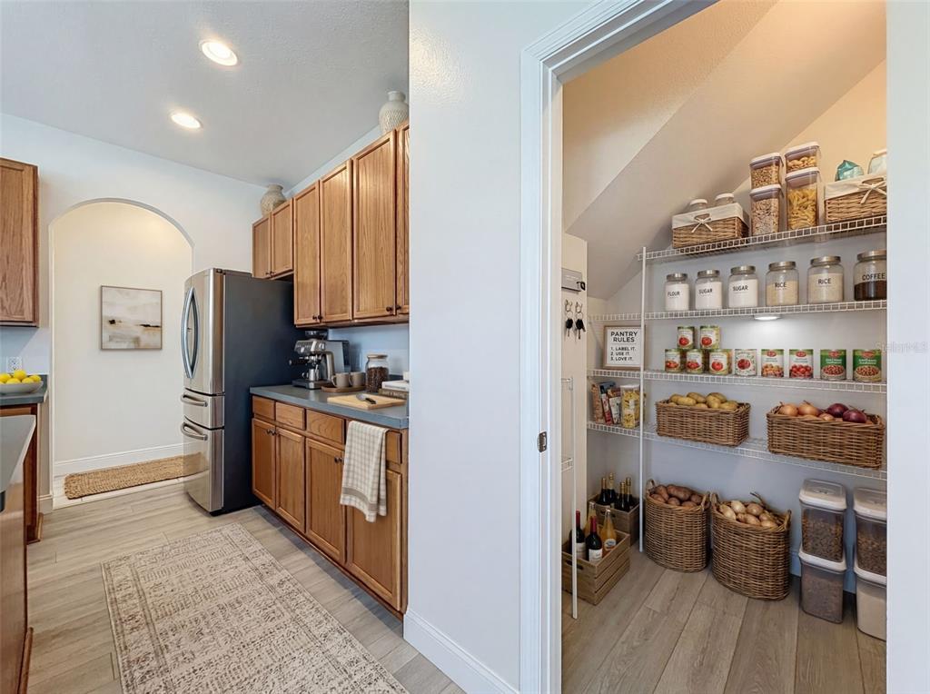 3311 Sisal Loop Wesley Chapel, FL 33544 - Photo 16 of 85 a kitchen with stainless steel appliances granite countertop a refrigerator and a stove top oven