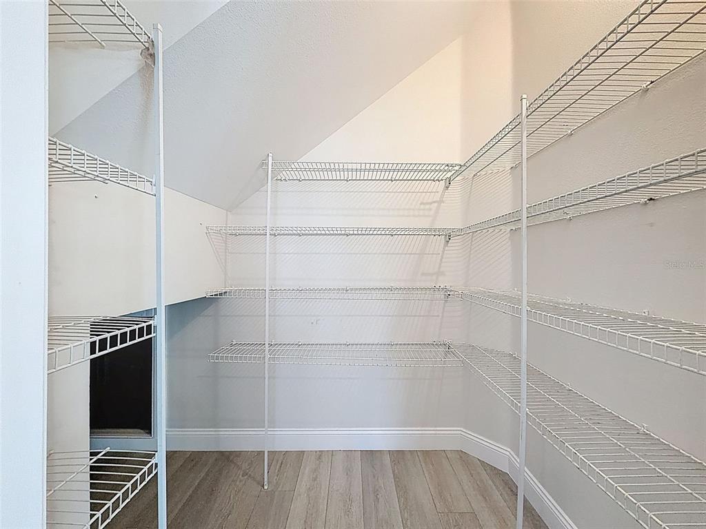 3311 Sisal Loop Wesley Chapel, FL 33544 - Photo 17 of 85 a view of a room with wooden floor