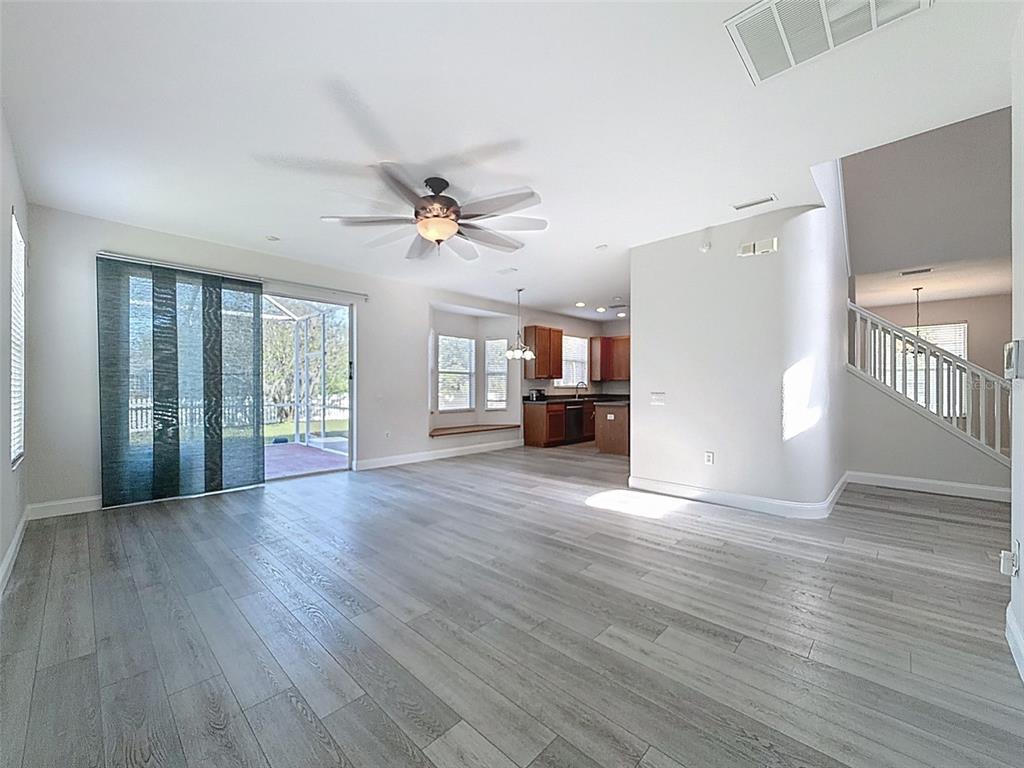3311 Sisal Loop Wesley Chapel, FL 33544 - Photo 26 of 85 a view of empty room with wooden floor and fan