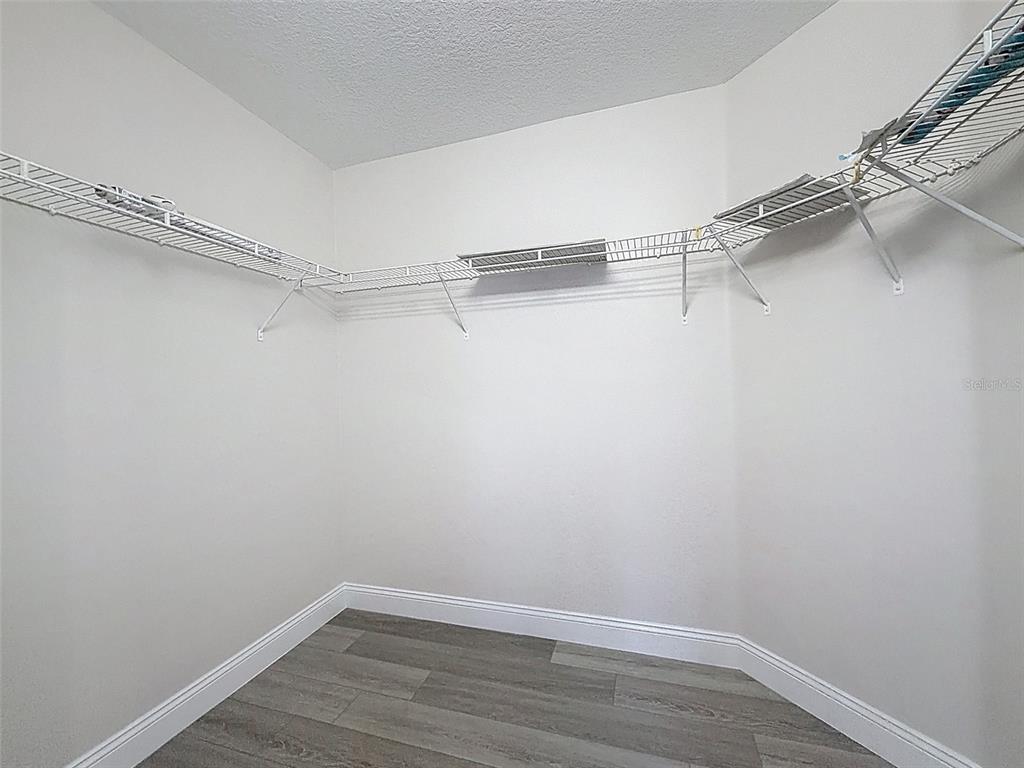 3311 Sisal Loop Wesley Chapel, FL 33544 - Photo 30 of 85 a view of an empty walk in closet