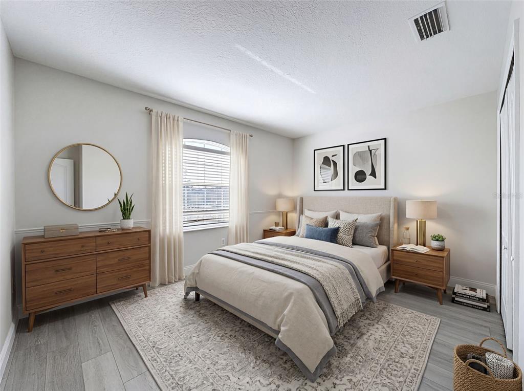 3311 Sisal Loop Wesley Chapel, FL 33544 - Photo 49 of 85 a bedroom with a bed and a dresser