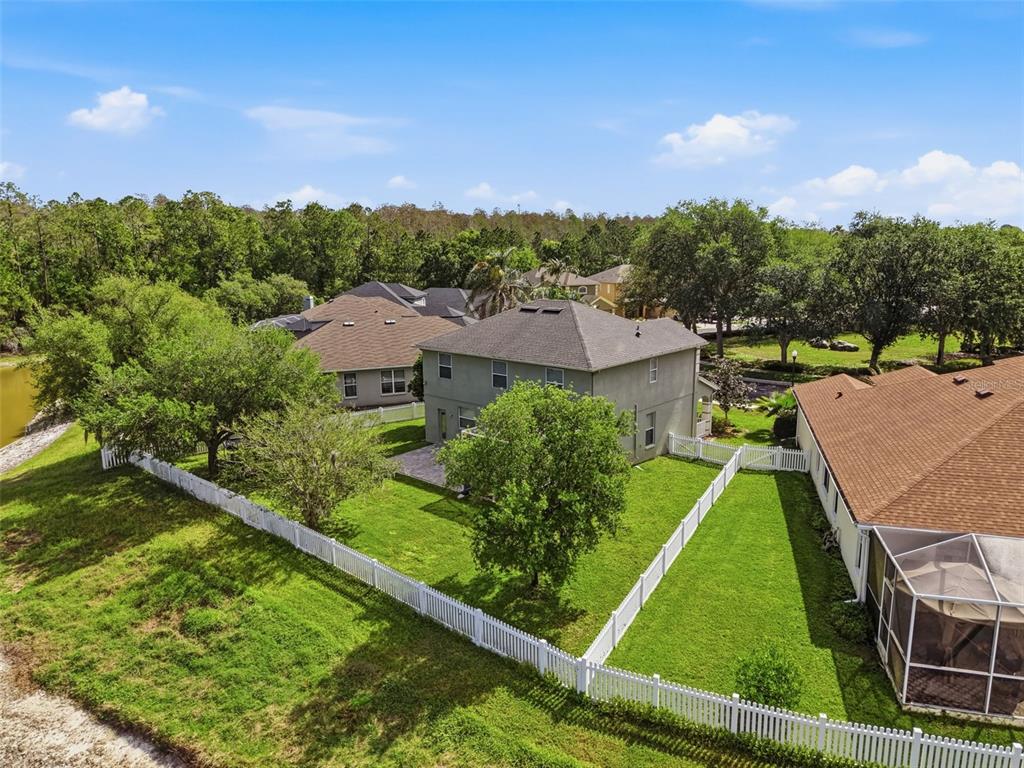 3311 Sisal Loop Wesley Chapel, FL 33544 - Photo 72 of 85 an aerial view of residential houses with outdoor space and trees