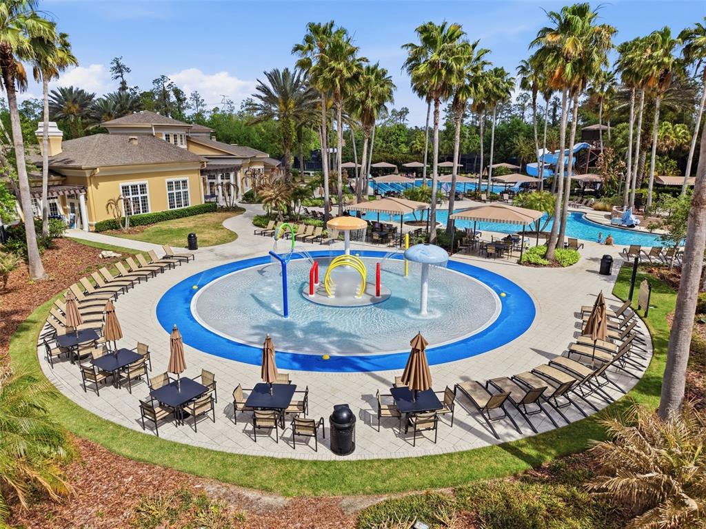 3311 Sisal Loop Wesley Chapel, FL 33544 - Photo 78 of 85 a swimming pool with outdoor seating yard and barbeque oven