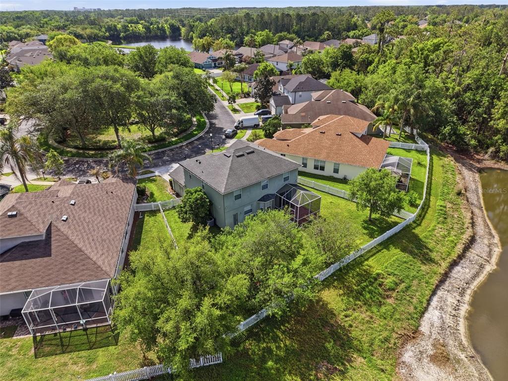 3311 Sisal Loop Wesley Chapel, FL 33544 - Photo 84 of 85 an aerial view of residential houses with outdoor space and trees