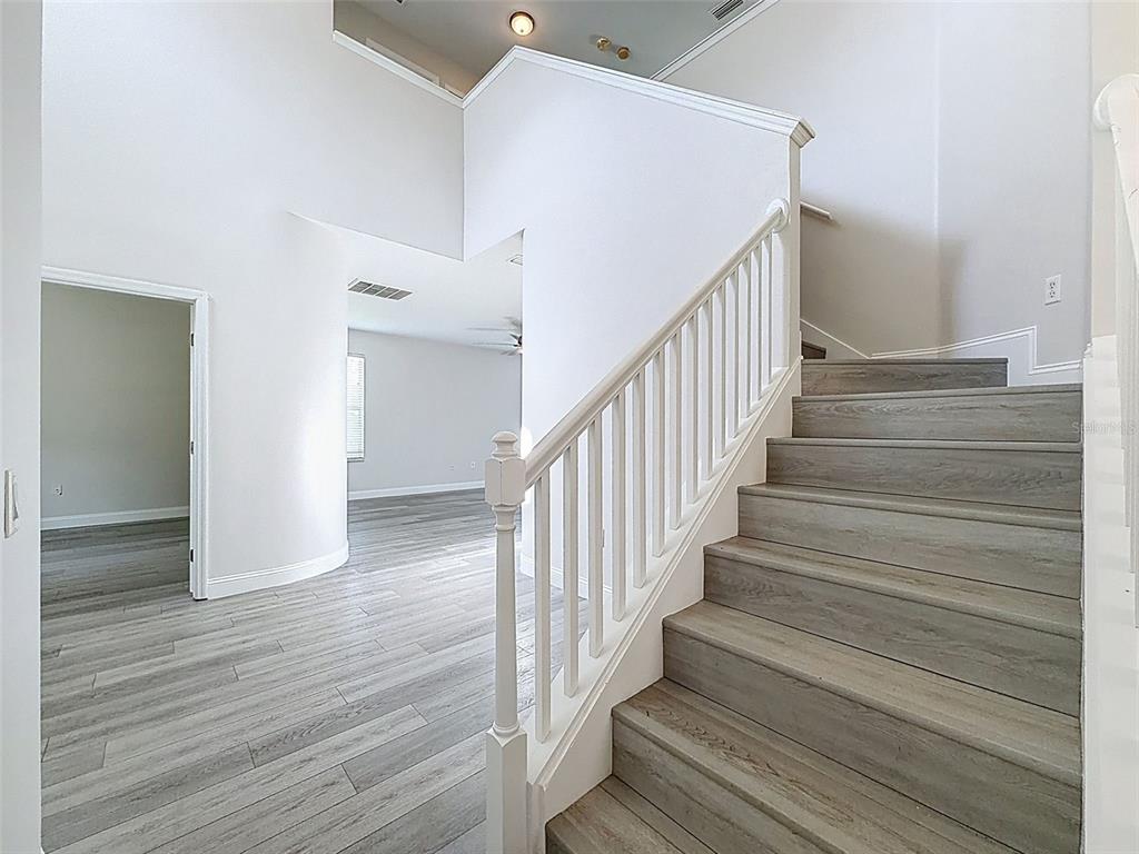 3311 Sisal Loop Wesley Chapel, FL 33544 - Photo 9 of 85 a view of entryway with wooden floor