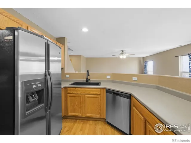 a kitchen with a sink stove and refrigerator