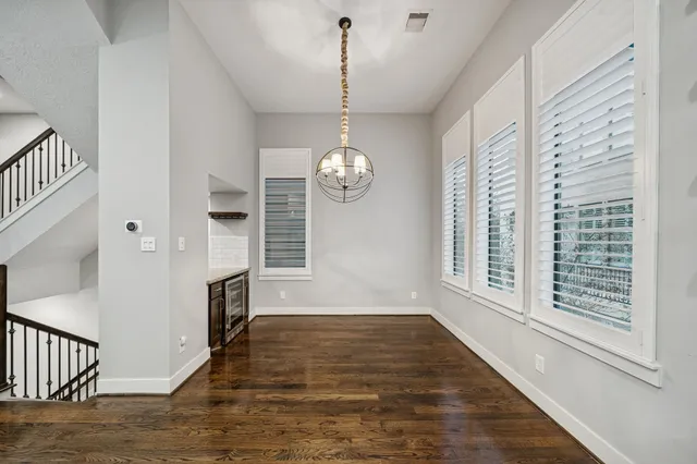 a kitchen with stainless steel appliances a refrigerator and a stove top oven