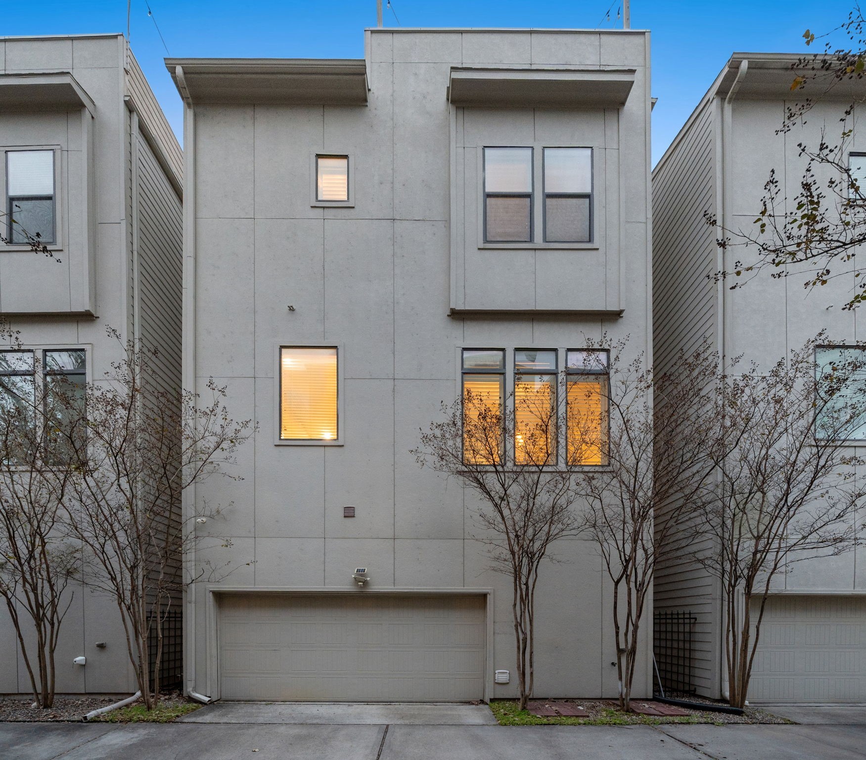 2105 Mason Street Houston, TX 77006 - Photo 35 of 43 Evening curb appeal shines with warm interior light and a well-kept streetscape—exactly the kind of setting that feels inviting the moment you arrive. This is a home that lives well day-to-day and shows beautifully for guests.