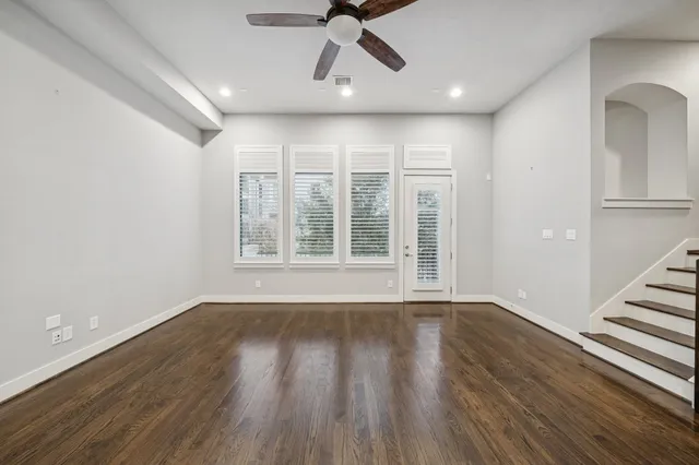 a view of a balcony with wooden fence and floor