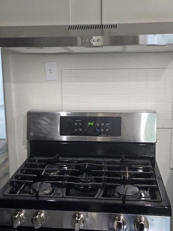2418 Centerville Road Dallas, TX 75228 - Photo 11 of 22 lUp-scale gas range with new hood