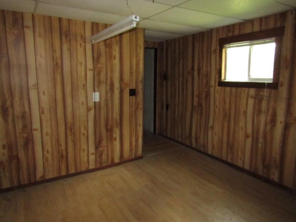 112 Wall Street Everson, PA 15631 - Photo 13 of 28 a view of a closet with wooden walls