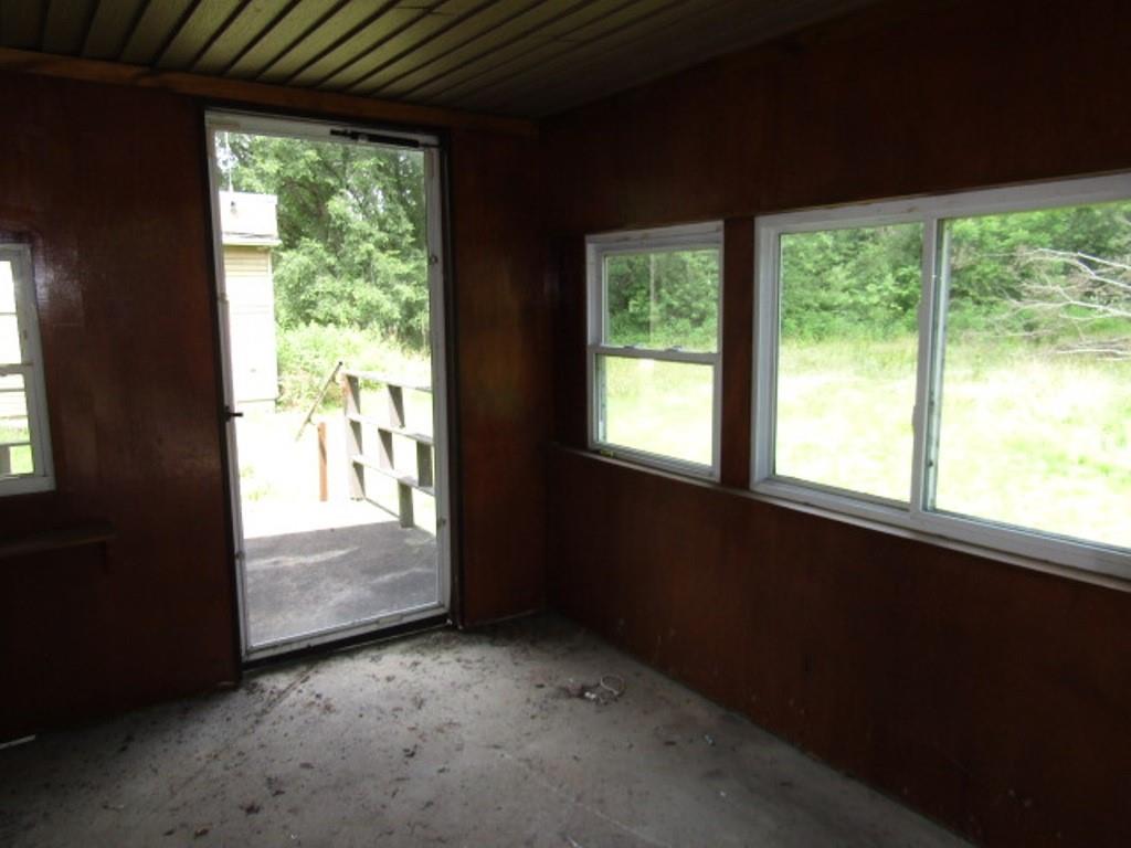 112 Wall Street Everson, PA 15631 - Photo 17 of 28 a view of an empty room with a window