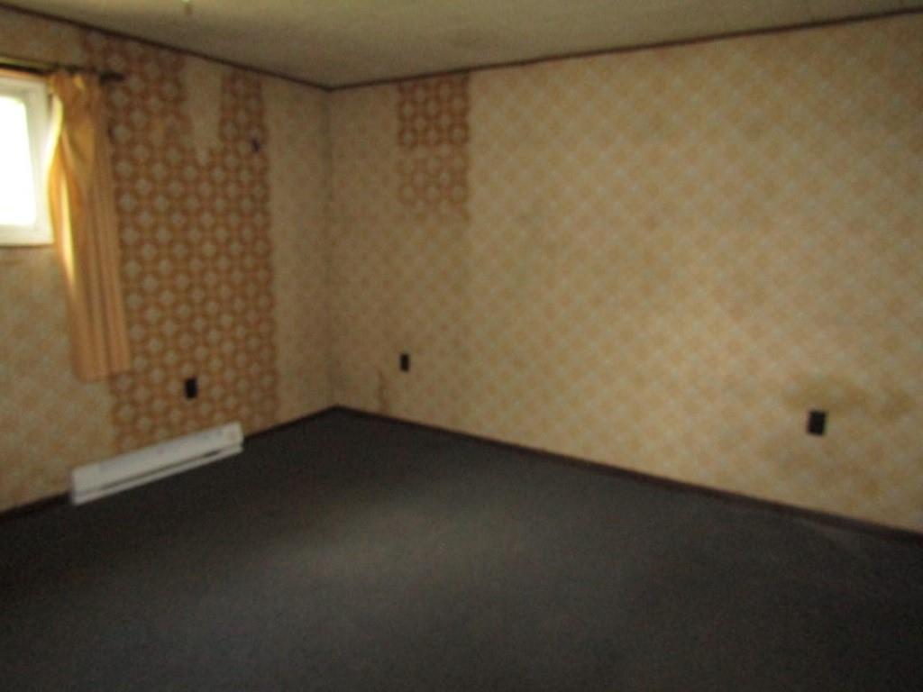 112 Wall Street Everson, PA 15631 - Photo 24 of 28 a view of a small space with wooden floor and a window