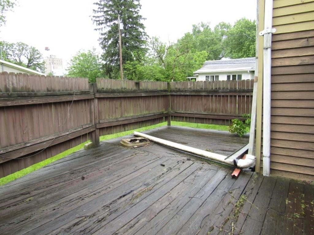 112 Wall Street Everson, PA 15631 - Photo 7 of 28 a view of swimming pool with a patio and wooden fence